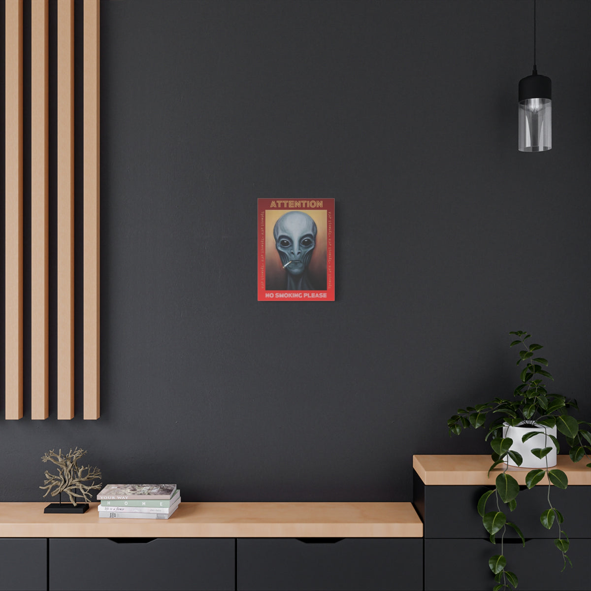 Studio shot of multiple sizes of the alien portrait canvases displayed together.