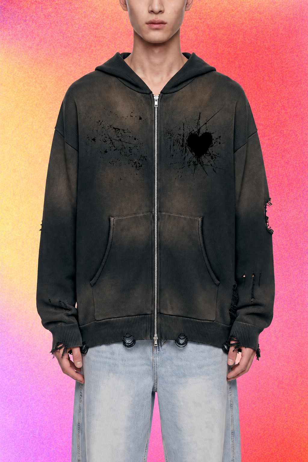 Folded black hoodie showing interior texture and vintage-washed finish.