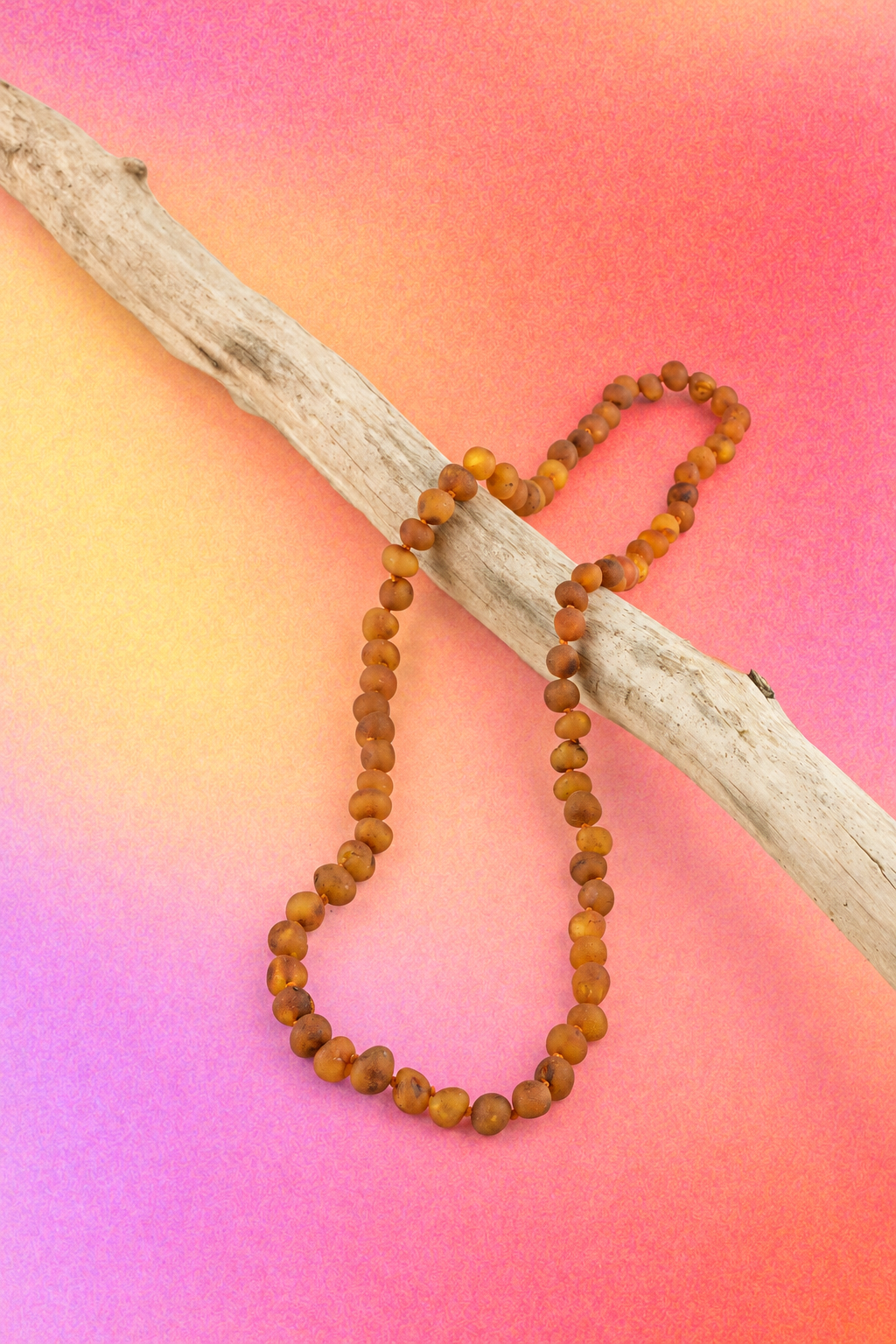 Hand-knotted cognac Baltic amber bead necklace with a classic screw clasp.