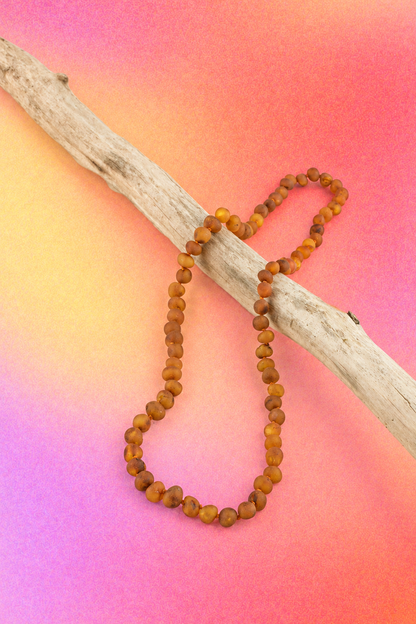 Hand-knotted cognac Baltic amber bead necklace with a classic screw clasp.